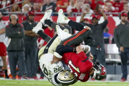 December 19, 2021, Tampa, Florida, USA: Tampa Bay Buccaneers quarterback Tom Brady 12 is sacked by New Orleans Saints defensive end Marcus Davenport 92 during the second quarter Sunday, Dec. 19, 2021 in Tampa. Tampa USA - ZUMAs70_ 0145597238st Copyright: xIvyxCeballox
