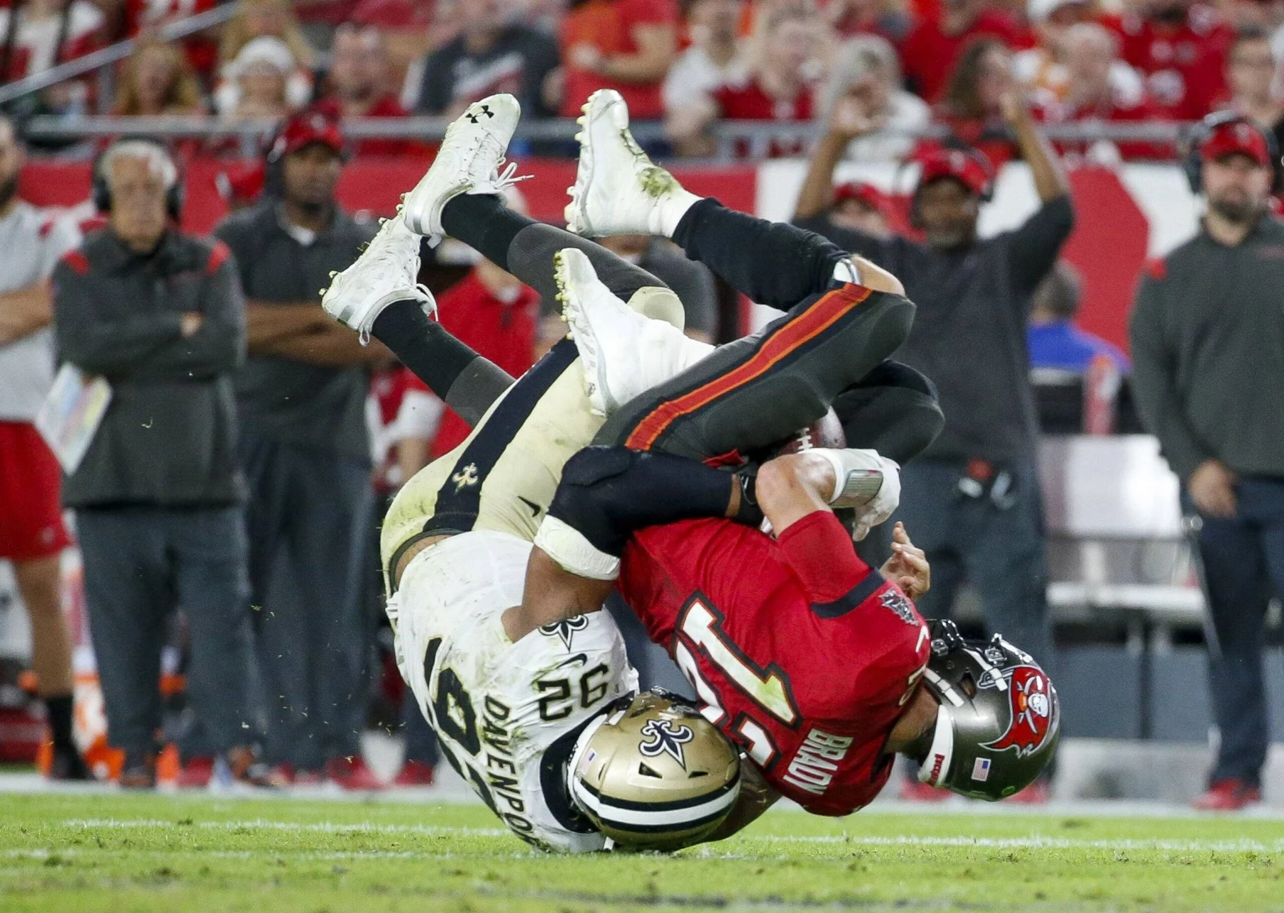 December 19, 2021, Tampa, Florida, USA: Tampa Bay Buccaneers quarterback Tom Brady 12 is sacked by New Orleans Saints defensive end Marcus Davenport 92 during the second quarter Sunday, Dec. 19, 2021 in Tampa. Tampa USA - ZUMAs70_ 0145597238st Copyright: xIvyxCeballox