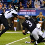 Aug 4th, 2022: Jarrett Stidham 3 and Travon Walker 44 during the Jacksonville Jaguars vs Las Vegas Raiders Hall of Fame Game in Canton, OH. /CSM Canton USA - ZUMAcp5_ 20220804_zaf_cp5_192 Copyright: xJasonxPohuskix