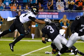 Aug 4th, 2022: Jarrett Stidham 3 and Travon Walker 44 during the Jacksonville Jaguars vs Las Vegas Raiders Hall of Fame Game in Canton, OH. /CSM Canton USA - ZUMAcp5_ 20220804_zaf_cp5_192 Copyright: xJasonxPohuskix