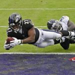 November 22, 2020, Baltimore, MD, USA: Baltimore Ravens J.K. Dobbins 27 dives for the end zone on a two-point conversion against the Tennessee Titans Breon Borders in the second quarter on Sunday, Nov. 22, 2020 at M&T Bank Stadium in Baltimore, Maryland. Baltimore USA - ZUMAm67_ 20201122_zaf_m67_002 Copyright: xKennethxK.xLamx