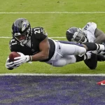 November 22, 2020, Baltimore, MD, USA: Baltimore Ravens J.K. Dobbins 27 dives for the end zone on a two-point conversion against the Tennessee Titans Breon Borders in the second quarter on Sunday, Nov. 22, 2020 at M&T Bank Stadium in Baltimore, Maryland. Baltimore USA - ZUMAm67_ 20201122_zaf_m67_002 Copyright: xKennethxK.xLamx