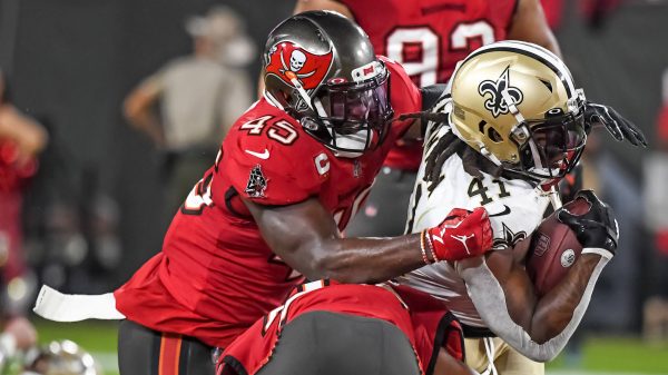Tampa Bay Buccaneers Devin White 45 wraps up New Orleans Saints running back Alvin Kamara 41 during the first half at Raymond James Stadium in Tampa, Florida on Sunday, December 19, 2021. PUBLICATIONxINxGERxSUIxAUTxHUNxONLY TPA20211219107 STEVExNESIUS