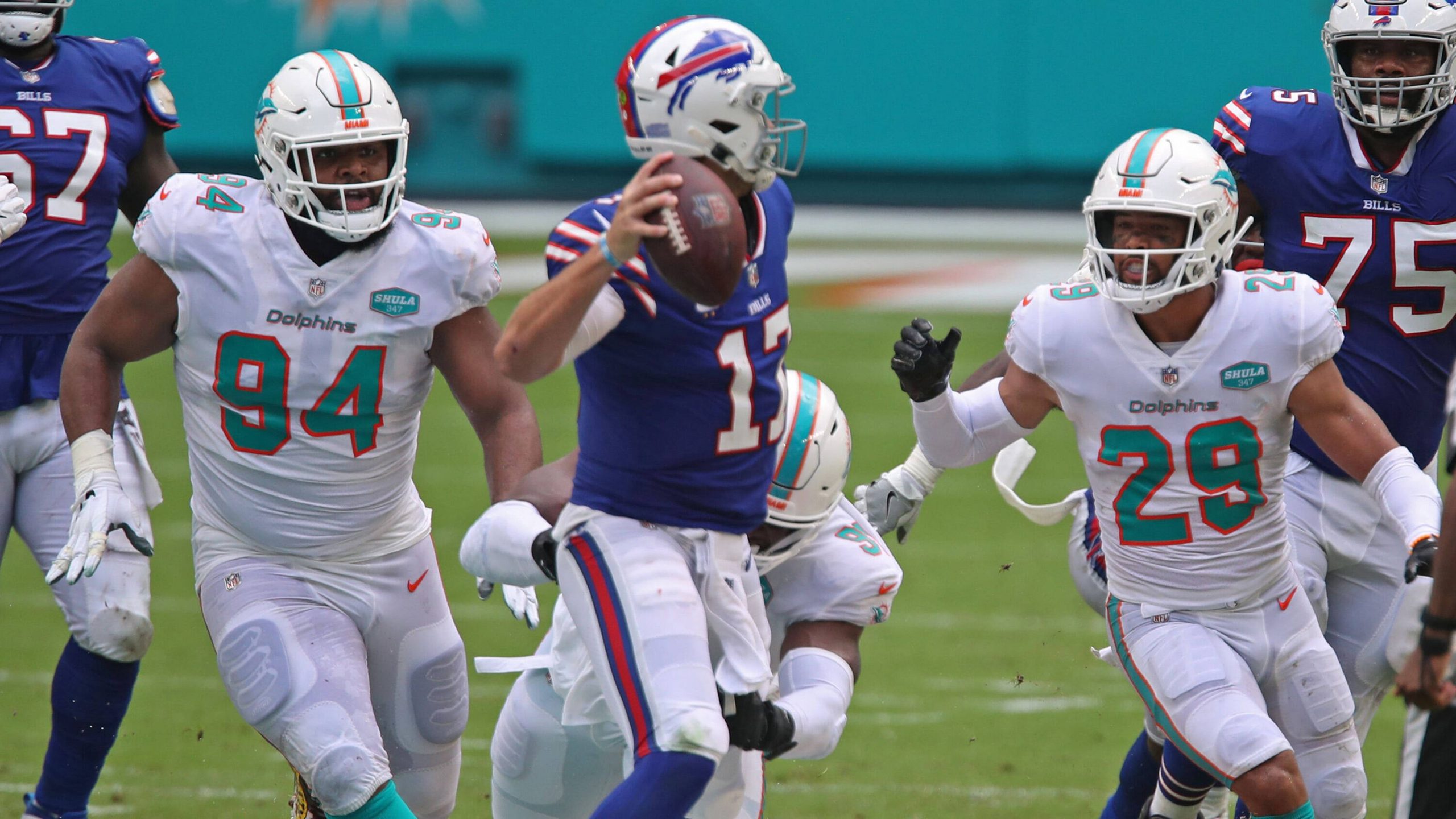 September 20, 2022: Miami Dolphins defensive tackle Christian Wilkins, left, and safety Brandon Jones will be chasing Buffalo Bills quarterback Josh Allen again on Sunday. - ZUMAm67_ 20220920_zaf_m67_071 Copyright: xJohnxMccallx