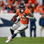 DENVER, CO - DECEMBER 12: Denver Broncos running back Javonte Williams 33 carries the ball during a game between the Denver Broncos and the Detroit Lions at Empower Field at Mile High on December 12, 2021 in Denver, Colorado. Photo by Dustin Bradford/Icon Sportswire NFL, American Football Herren, USA DEC 12 Lions at Broncos Icon132211212200