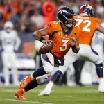 DENVER, CO - OCTOBER 06: Denver Broncos quarterback Russell Wilson 3 scrambles during an NFL, American Football Herren, USA game between the Indianapolis Colts and the Denver Broncos at Empower Field at Mile High on October 06, 2022 in Denver, Colorado. Photo by Brandon Sloter/Icon Sportswire NFL: OCT 06 Colts at Broncos Icon221006127