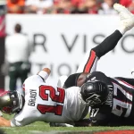 TAMPA, FL - OCTOBER 09: Atlanta Falcons Defensive Tackle Grady Jarrett 97 sacks Tampa Bay Buccaneers Quarterback Tom Brady 12 but receives a penalty on this play during the regular season game between the Atlanta Falcons and the Tampa Bay Buccaneers on October 09, 2022 at Raymond James Stadium in Tampa, Florida. Photo by Cliff Welch/Icon Sportswire NFL, American Football Herren, USA OCT 09 Falcons at Buccaneers Icon357221009026