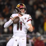 CHICAGO, IL - OCTOBER 13: Washington Commanders quarterback Carson Wentz 11 throws the football in action during a game between the Chicago Bears and the Washington Commanders on October 13, 2022 at Soldier Field, in Chicago, IL. Photo by Robin Alam/Icon Sportswire NFL, American Football Herren, USA OCT 13 Commanders at Bears Icon164221013007