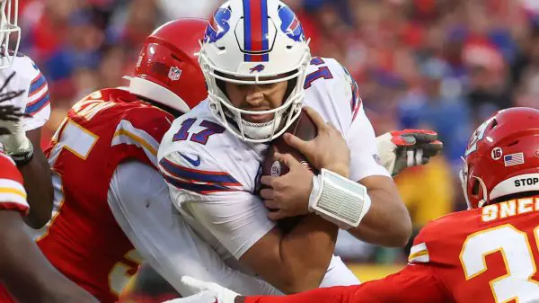 KANSAS CITY, MO - OCTOBER 16: Buffalo Bills quarterback Josh Allen 17 secures the ball as he is tackled in the fourth quarter of an NFL, American Football Herren, USA game between the Buffalo Bills and Kansas City Chiefs on October 16, 2022 at GEHA Field at Arrowhead Stadium in Kansas City, MO. Photo by Scott Winters/Icon Sportswire NFL: OCT 16 Bills at Chiefs Icon2210160840