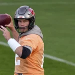 Tampa Bay Buccaneers quarterback Tom Brady throws a ball during a practice session in Munich, Germany, Friday, Nov. 11, 2022. The Tampa Bay Buccaneers are set to play the Seattle Seahawks in an NFL game at the Allianz Arena in Munich on Sunday. (AP Photo/Matthias Schrader)