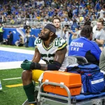 DETROIT, MI - NOVEMBER 06: Green Bay Packers linebacker Rashan Gary 52 looks on as he rides on a medical cart that takes him off of the field during the second quarter of an NFL, American Football Herren, USA regular season football game between the Green Bay Packers and the Detroit Lions on November 6, 2022 at Ford Field in Detroit, Michigan. Photo by Scott W. Grau/Icon Sportswire NFL: NOV 06 Packers at Lions Icon22110638