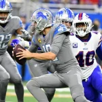 NFL, American Football Herren, USA Buffalo Bills at Detroit Lions Nov 24, 2022 Detroit, Michigan, USA Detroit Lions quarterback Jared Goff 16 scrambles away from Buffalo Bills linebacker Von Miller 40 in the first quarter at Ford Field. Detroit Ford Field Michigan USA, EDITORIAL USE ONLY PUBLICATIONxINxGERxSUIxAUTxONLY Copyright: xLonxHorwedelx 20221124_tbs_jr6_051
