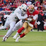 Jimmy Garoppolo - NFL, American Football Herren, USA Miami Dolphins at San Francisco 49ers Dec 4, 2022 Santa Clara, California, USA San Francisco 49ers quarterback Jimmy Garoppolo 10 is sacked by Miami Dolphins inside linebacker Jerome Baker 55 and offensive linebacker Jaelan Phillips 15 during the first quarter at Levi s Stadium. Santa Clara Levi s Stadium California USA, EDITORIAL USE ONLY PUBLICATIONxINxGERxSUIxAUTxONLY Copyright: xKelleyxLxCoxx 20221204_ams_ax5_0256