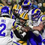 NFL, American Football Herren, USA Los Angeles Rams at Green Bay Packers Dec 19, 2022 Green Bay, Wisconsin, USA Green Bay Packers running back AJ Dillon 28 scores a touchdown in the second quarter against the Los Angeles Rams at Lambeau Field. Green Bay Lambeau Field Wisconsin USA, EDITORIAL USE ONLY PUBLICATIONxINxGERxSUIxAUTxONLY Copyright: xBennyxSieux 20221219_ojr_bs5_152