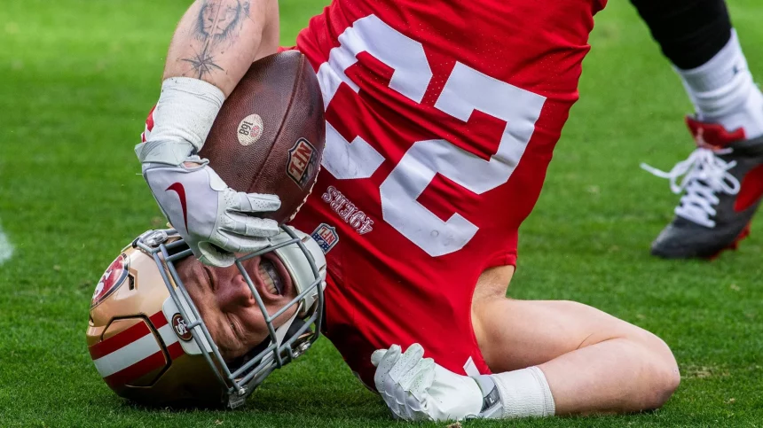 49ers - christian mccaffrey - SANTA CLARA, CA - DECEMBER 11: San Francisco 49ers running back Christian McCaffrey 23 gets turned upside down rushing in the first quarter of an NFL, American Football Herren, USA game between the San Francisco 49ers and Tampa Bay Buccaneers on December 11, 2022, at Levis Stadium, in Santa Clara, CA. Photo by Tony Ding/Icon Sportswire NFL: DEC 11 Buccaneers at 49ers Icon46520221211025