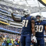 October 23, 2022, Los Angeles, California, USA: Los Angeles Chargers wide receiver Mike Williams 81 celebrates with running back Austin Ekeler 30 after scoring a touchdown against the Seattle Seahawks during the first half at an NFL, American Football Herren, USA football game, Saturday, Oct. 23, 2022, in Inglewood, Calif. Los Angeles USA - ZUMAc68_ 20221023_zaf_c68_051 Copyright: xRingoxChiux