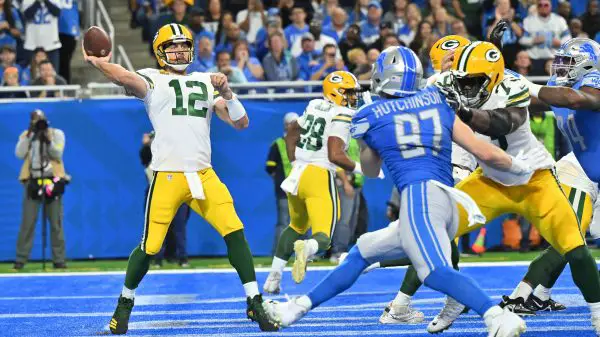 DETROIT, MI - NOVEMBER 06: Green Bay Packers QB Aaron Rodgers 12 throws from his own end zone while Detroit Lions Defensive End 97 Aidan Hutchinson rushes from the outside during the game between Green Bay Packers and Detroit Lions on November 6, 2022 in Detroit, MI Allan Dranberg/CSM Detroit United States - ZUMAc04_ 20221106_zaf_c04_272 Copyright: xAllanxDranberg/Csmx