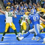 DETROIT, MI - NOVEMBER 06: Green Bay Packers QB Aaron Rodgers 12 throws from his own end zone while Detroit Lions Defensive End 97 Aidan Hutchinson rushes from the outside during the game between Green Bay Packers and Detroit Lions on November 6, 2022 in Detroit, MI Allan Dranberg/CSM Detroit United States - ZUMAc04_ 20221106_zaf_c04_272 Copyright: xAllanxDranberg/Csmx