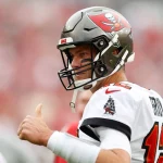 January 1, 2023, Tampa, Florida, USA: Tampa Bay Buccaneers quarterback Tom Brady 12 warms up and talks with teammates ahead of a Bucs game against the Carolina Panthers at Bucs Beach on Sunday, Jan. 1, 2023, in Tampa. Tampa USA - ZUMAs70_ 0197312946st Copyright: xJeffereexWoox