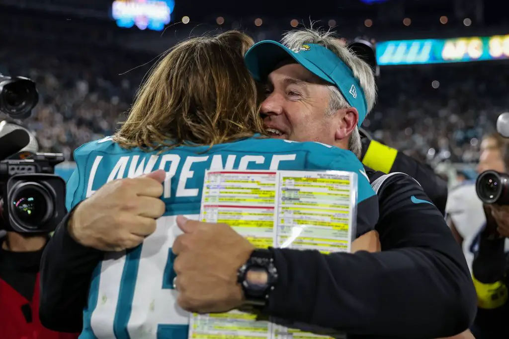 Sport Bilder des Tages January 7, 2023: Jacksonville Jaguars quarterback TREVOR LAWRENCE 16 embraces Jacksonville Jaguars head coach Doug Pederson after winning the game during the Jacksonville Jaguars vs Tennessee Titans NFL, American Football Herren, USA game at TIAA Bank Field Stadium in Jacksonville, Fl on January 7, 2023. - ZUMAk149 20230107_zsp_k149_042 Copyright: xCoryxKnowltonx