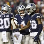 LANDOVER, MD - JANUARY 08: Cowboys running back Tony Pollard 20 and quarterback Dak Prescott 4 congratulate wide receiver CeeDee Lamb 88 after his touchdown catch during the Dallas Cowboys versus Washington Commanders National Football League game at FedEx Field on January 8, 2023 in Landover, MD. Photo by Randy Litzinger/Icon Sportswire NFL, American Football Herren, USA JAN 08 Cowboys at Commanders Icon9662301080918