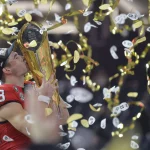 Stetson Bennett 13 of the Georgia Bulldogs celebrates with the College Football Playoff National Championship Trophy after defeating the TCU Horned Frogs at the 2023 NCAA, College League, USA College Football National Championship between Georgia and TCU at SoFi Stadium in Inglewood, California, on Monday, January 9, 2023. Georgia defeated TCU 65-7. PUBLICATIONxINxGERxSUIxAUTxHUNxONLY LAX20230109142 MIKExGOULDING