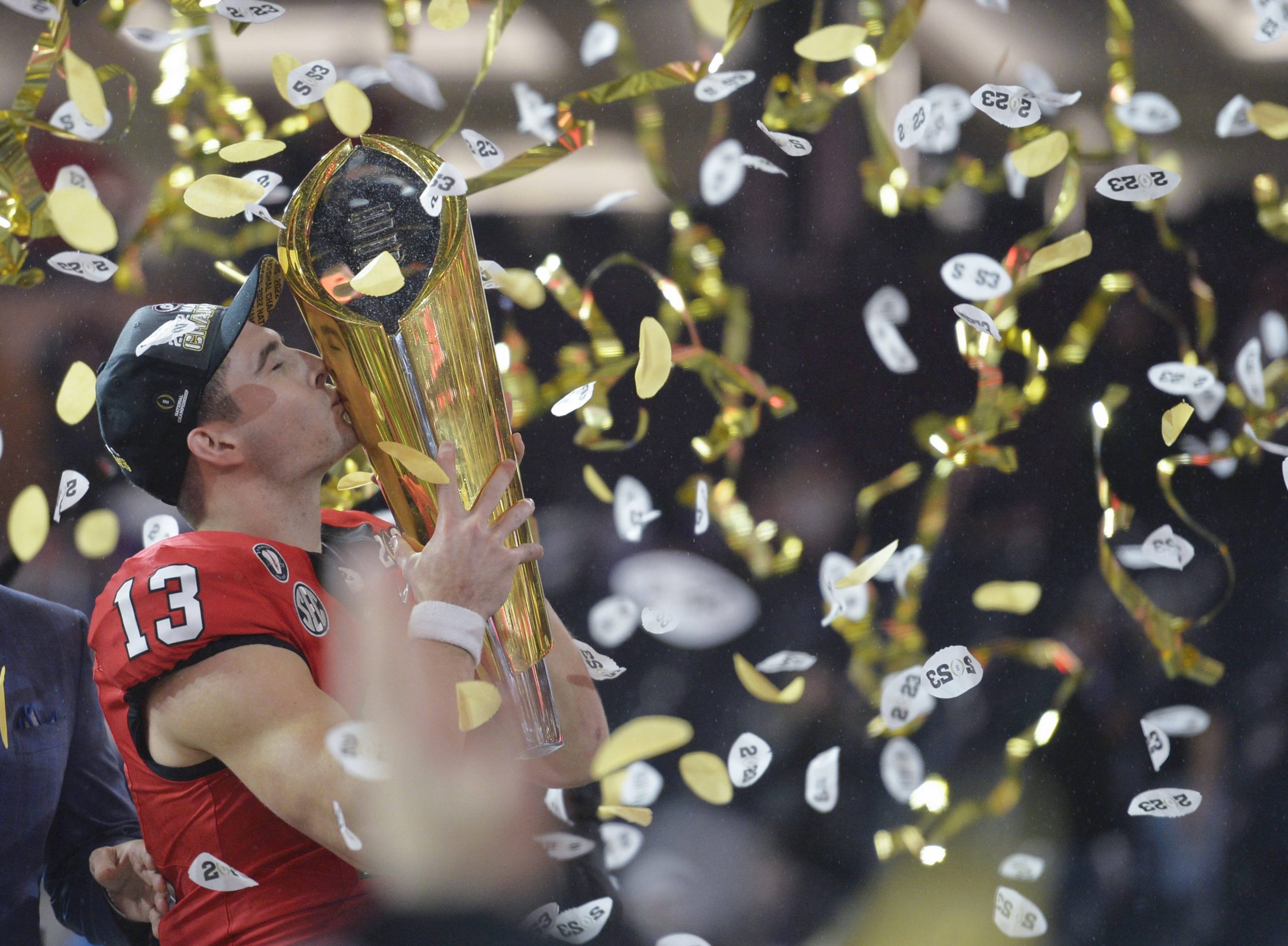 Stetson Bennett 13 of the Georgia Bulldogs celebrates with the College Football Playoff National Championship Trophy after defeating the TCU Horned Frogs at the 2023 NCAA, College League, USA College Football National Championship between Georgia and TCU at SoFi Stadium in Inglewood, California, on Monday, January 9, 2023. Georgia defeated TCU 65-7. PUBLICATIONxINxGERxSUIxAUTxHUNxONLY LAX20230109142 MIKExGOULDING