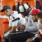 January 16, 2023, Tampa, Florida, USA: Tampa Bay Buccaneers quarterback Tom Brady 12, far left, is seen on the bench during the third quarter against the Dallas Cowboys in an NFC wild-card game Monday, Jan 16, 2023, in Tampa. Tampa USA - ZUMAs70_ 0199589763st Copyright: xDouglasxR.xCliffordx