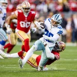 Hip-Drop-Tackle SANTA CLARA, CA - JANUARY 22: Dallas Cowboys running back Tony Pollard 20 is tackled and twists his ankle during the NFL, American Football Herren, USA NFC Divisional Playoff game between the Dallas Cowboys and San Francisco 49ers at Levis Stadium in Santa Clara, CA. Photo by Bob Kupbens/Icon Sportswire NFL: JAN 22 NFC Divisional Playoffs - TBD at 49ers Icon230122020