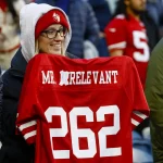NFL, American Football Herren, USA San Francisco 49ers at Seattle Seahawks Dec 15, 2022 Seattle, Washington, USA A fan holds an altered Mr. Irrelevant jersey for San Francisco 49ers quarterback Brock Purdy not pictured during pregame warmups against the Seattle Seahawks at Lumen Field. Mr. Irrelevant refers to the final pick of the NFL draft. Seattle Lumen Field Washington USA, EDITORIAL USE ONLY PUBLICATIONxINxGERxSUIxAUTxONLY Copyright: xJoexNicholsonx 20221215_jmn_sn8_004