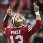 San Francisco 49ers quarterback Brock Purdy 13 celebrates after a 74 yard touchdown pass to wide receiver Deebo Samuel in the fourth quarter against the Seattle Seahawks in the NFC Wildcard game at Levi s Stadium in Santa Clara, California on Saturday, January 14, 2023. The 49ers defeated the Seahawks 41 - NFL Woche 16