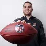 AUBURN, AL - March 20, 2023 - Kilian Zierer poses during a photoshoot in the locker room at the Woltosz Football Performance Center in Auburn, AL.