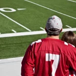 American football fans at field with copy space