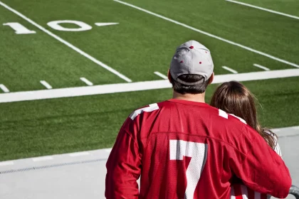 American football fans at field with copy space