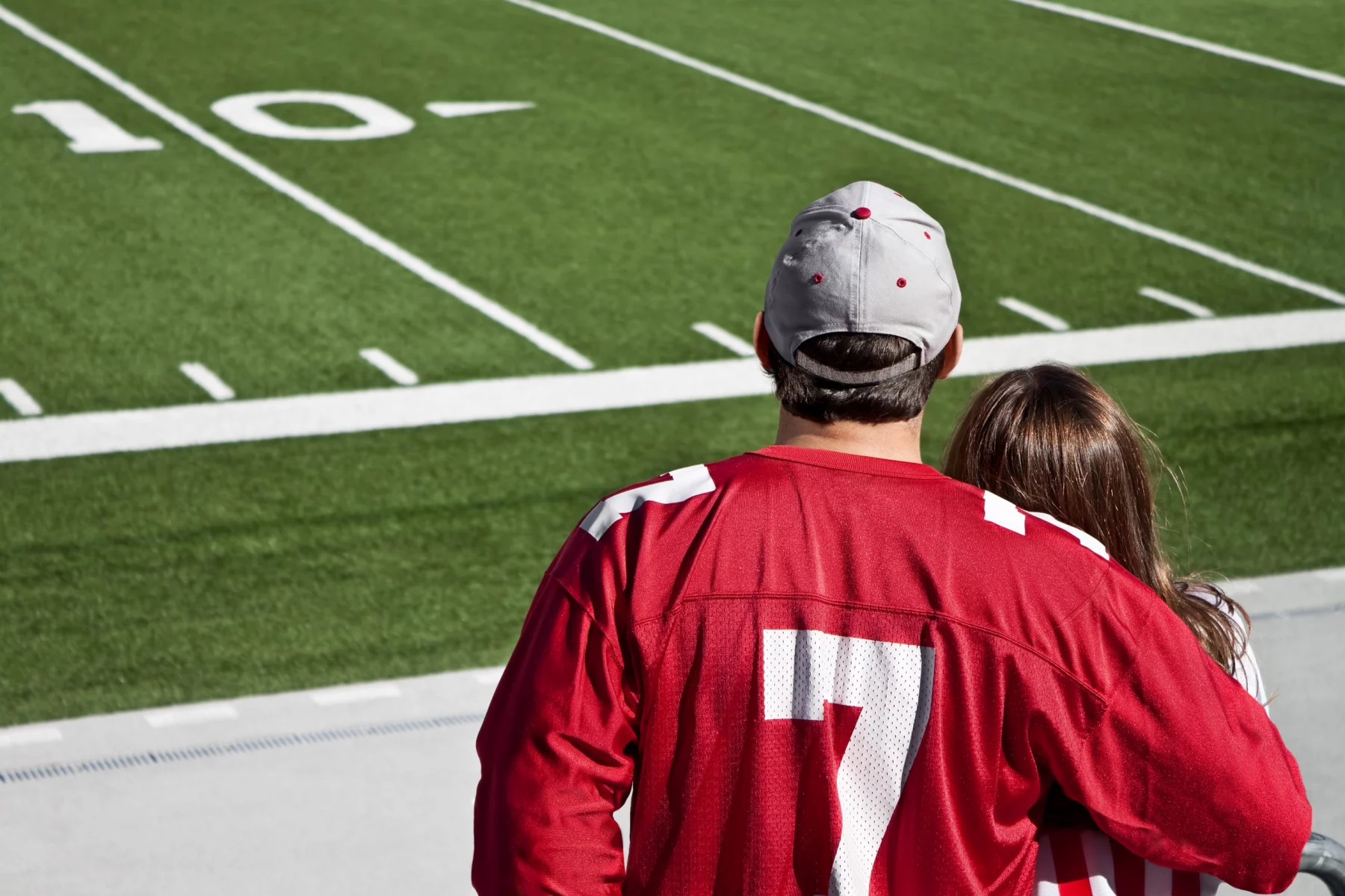 American football fans at field with copy space