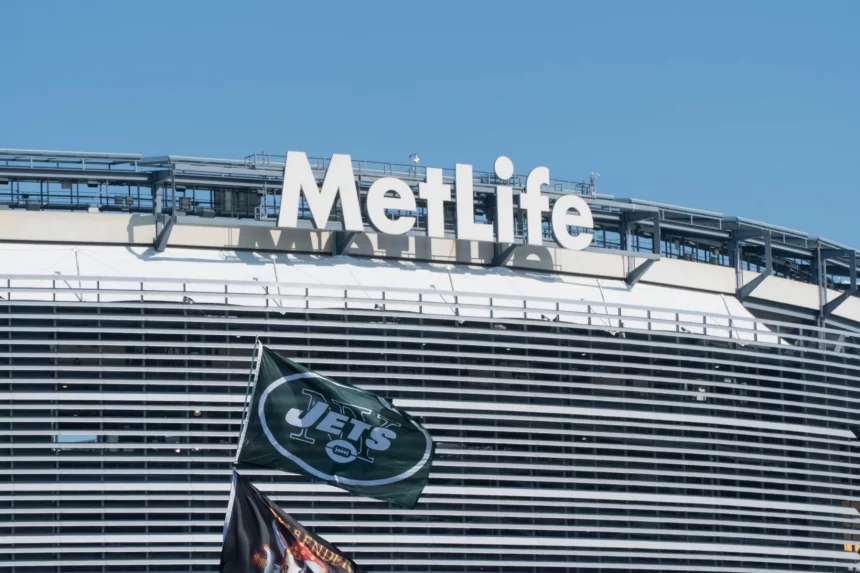 East Rutherford, New Jersey - Circa 2017: New York Jets football team flag waves in wind during parking lot tailgate outside Metlife Stadium before season game