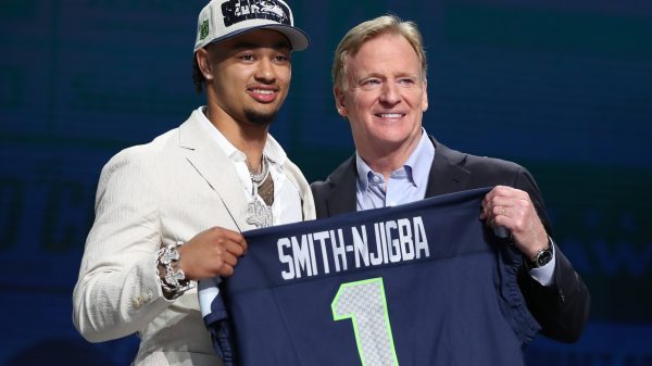 KANSAS CITY, MO - APRIL 27: Ohio State wide receiver Jaxon Smith-Njigba holds a jersey with commission Roger Goodell after being drafted in the first round of the NFL, American Football Herren, USA Draft on April 27, 2023 at Union Station in Kansas City, MO. Photo by Scott Winters/Icon Sportswire NFL: APR 27 2023 Draft EDITORIAL USE ONLY Icon2304270567