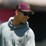 MLB, Baseball Herren, USA Texas Rangers at Oakland Athletics May 14, 2023 Oakland, California, USA San Francisco 49ers quarterback Trey Lance stands on the field before the game between the Oakland Athletics and the Texas Rangers at Oakland-Alameda County Coliseum. Oakland Oakland-Alameda County Coliseum California USA, EDITORIAL USE ONLY PUBLICATIONxINxGERxSUIxAUTxONLY Copyright: xDarrenxYamashitax 20230514_tbs_yl1_084