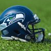NFL Seattle Seahawks helmet on artificial grass playing turf , product shot