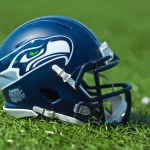 Nick Emmanwori - NFL Seattle Seahawks helmet on artificial grass playing turf , product shot