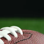 Football on a field at NFL Preseason