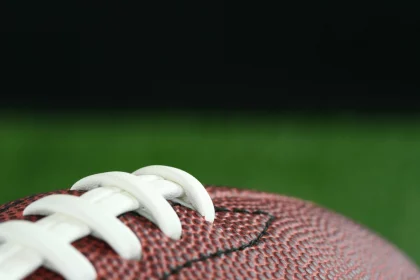 Football on a field at NFL Preseason
