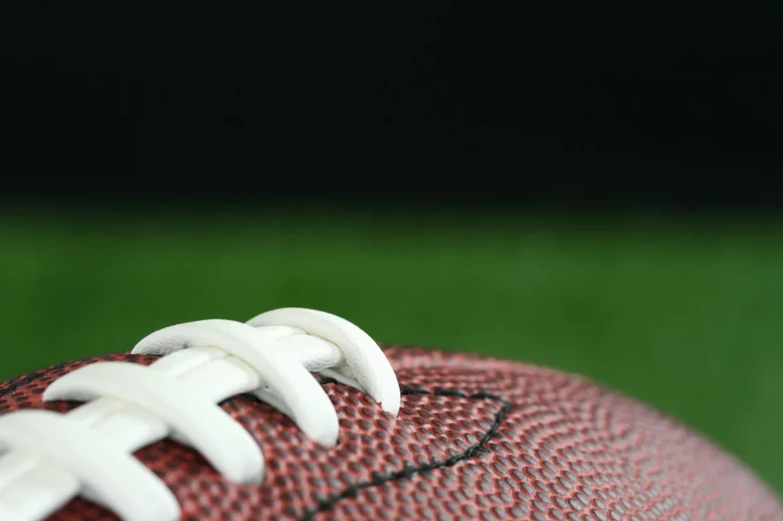 Football on a field at NFL Preseason