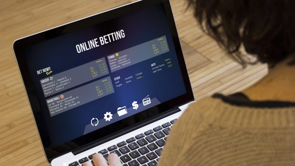 betting at home: close up view of woman using the computer to bet