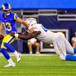 NFL, American Football Herren, USA 2023: Chargers vs Rams AUG 12 August 12, 2023 Inglewood, CA.Los Angeles Rams quarterback Stetson Bennett 13 is pressured and sacked by Los Angeles Chargers defensive tackle CJ Okoye 67 in action in the fourth quarter during the NFL Preseason football game against the Los Angeles Chargers..Mandatory Photo Credit: Louis Lopez/Cal Media/Sipa USA Credit Image: Louis Lopez/Cal Sport Media/Sipa USA Inglewood California United States of America NOxUSExINxGERMANY PUBLICATIONxINxALGxARGxAUTxBRNxBRAxCANxCHIxCHNxCOLxECUxEGYxGRExINDxIRIxIRQxISRxJORxKUWxLIBxLBAxMLTxMEXxMARxOMAxPERxQATxKSAxSUIxSYRxTUNxTURxUAExUKxVENxYEMxONLY Copyright: xCalxSportxMediax Editorial use only