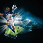 Soccer player, cellphone and ball on a stadium