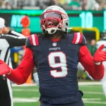 FootballR - NFL - Der Spieler, Matthew Judon, der New England Patriots feiert auf dem Feld seinen Sieg gegen die Dallas Cowboys.