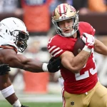 FootballR - NFL - Fußballspieler der San Francisco 49ers läuft mit dem Ball. Christian McCaffrey