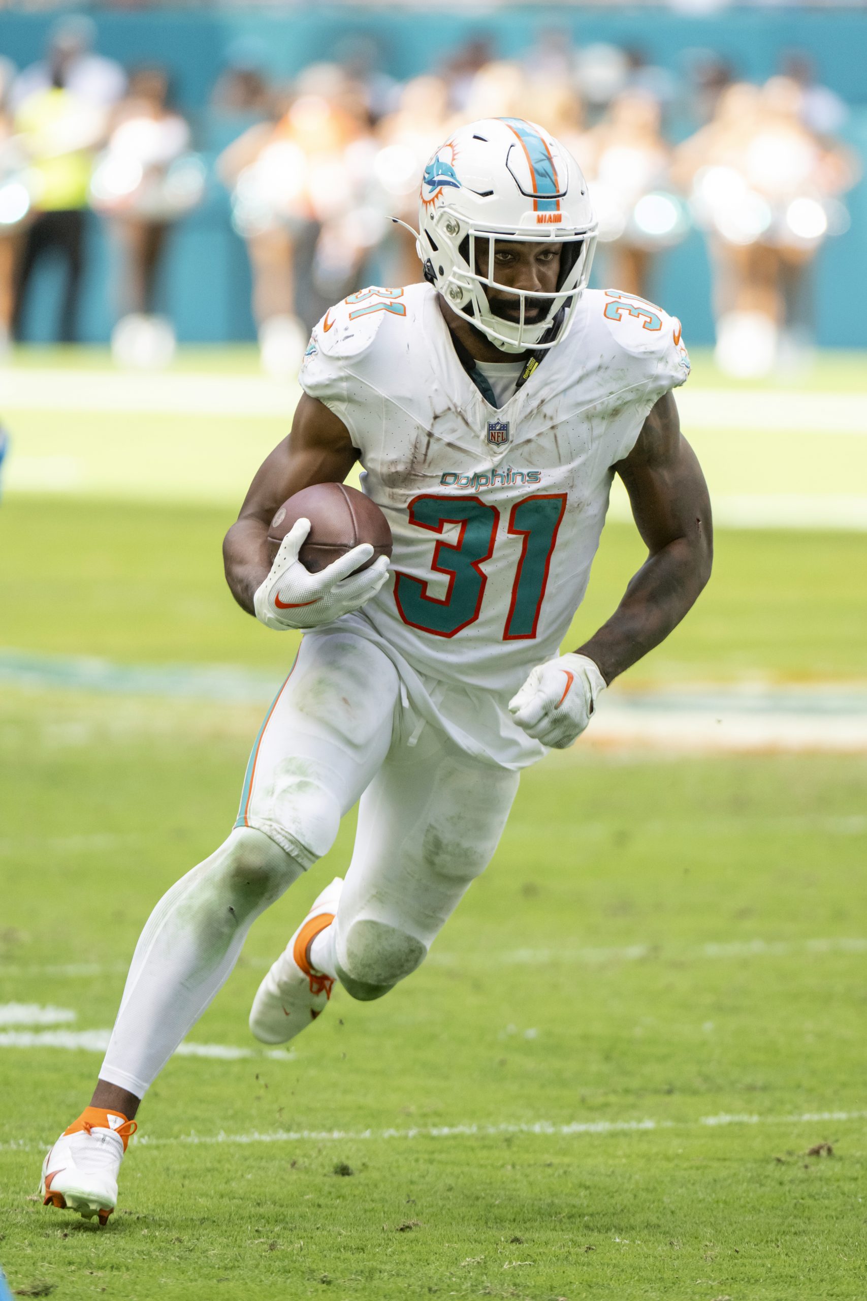Miami Dolphins running back Raheem Mostert (31) runs with the ball during an NFL football game against the Carolina Panthers, Sunday, Oct. 15, 2023, in Miami Gardens, Fla. (AP Photo/Doug Murray)