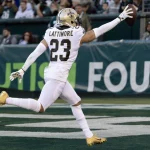 FootballR - NFL - Saints NFL-Spieler Marshon Lattimore feiert einen Touchdown.